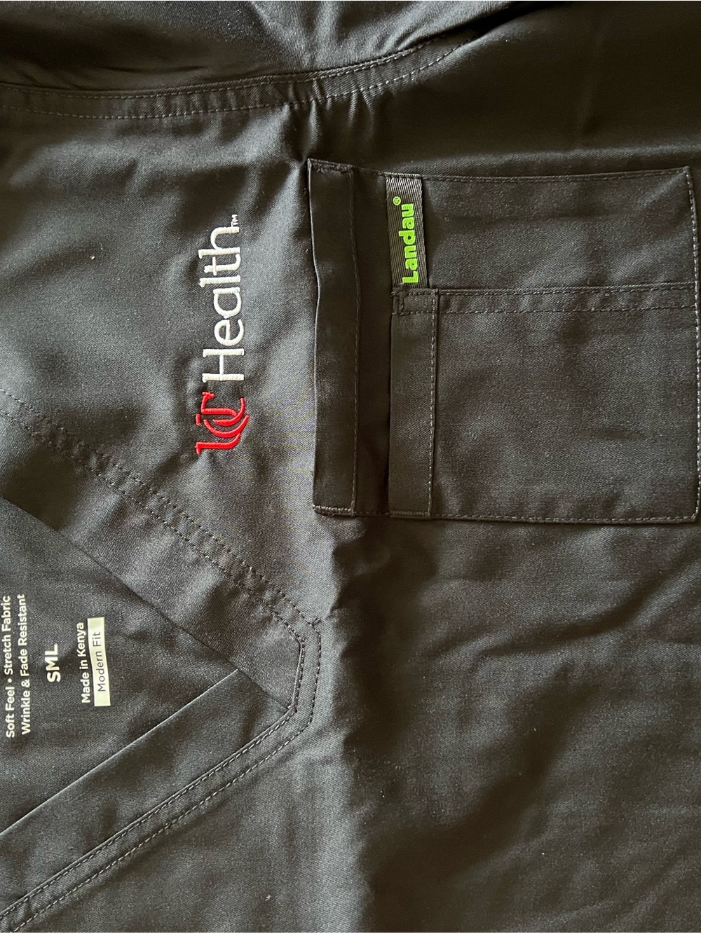 UC Health Landau Black Scrub Top with Pocket and Green Tag